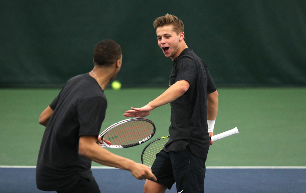 Will Davies and Oliver Okonkwo plays a doubles match against the Miami Hurricanes Friday, February 8, 2019 at the Hawkeye Tennis and Recreation Complex. (Brian Ray/hawkeyesports.com)