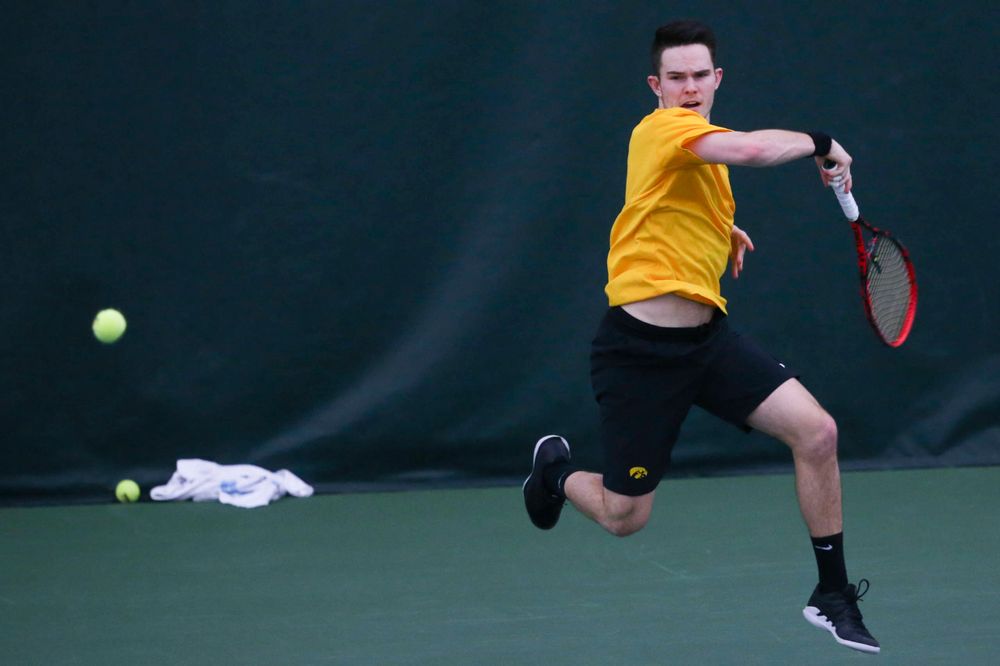 Iowa's Jonas Larsen at a tennis match vs Drake Friday, March 8, 2019 at the Hawkeye Tennis and Recreation Complex. (Lily Smith/hawkeyesports.com)