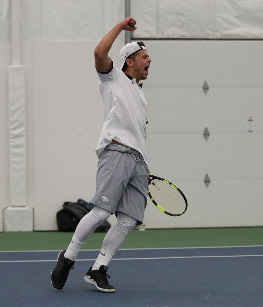 Iowa's Will Davies and Oliver Okonkwo celebrate after winning a doubles match against Western Michigan Saturday, January 19, 2019 at the Hawkeye Tennis and Recreation Complex. (Brian Ray/hawkeyesports.com)