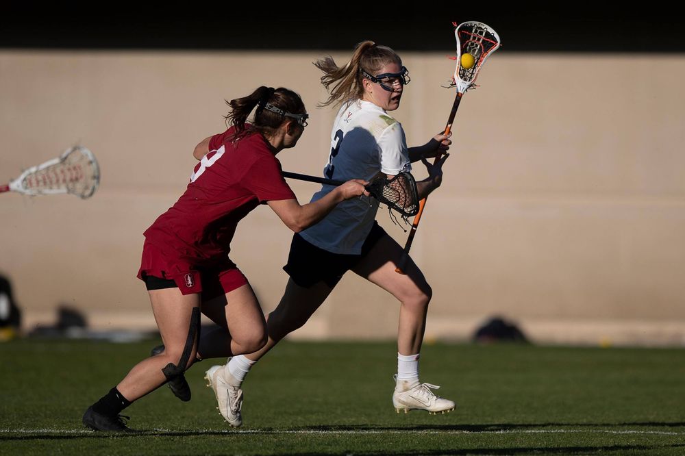 STANFORD, California - FEBRUARY 14: Virginia Cavaliers midfield Sammy Mueller (2) is defended by Stanford Cardinal defense Kyra Pelton (8) during the second half at Cagan Stadium on February 14, 2020 in Stanford, California. The Virginia Cavaliers defeated the Stanford Cardinal 12-11. (Photo by Jason O. Watson)