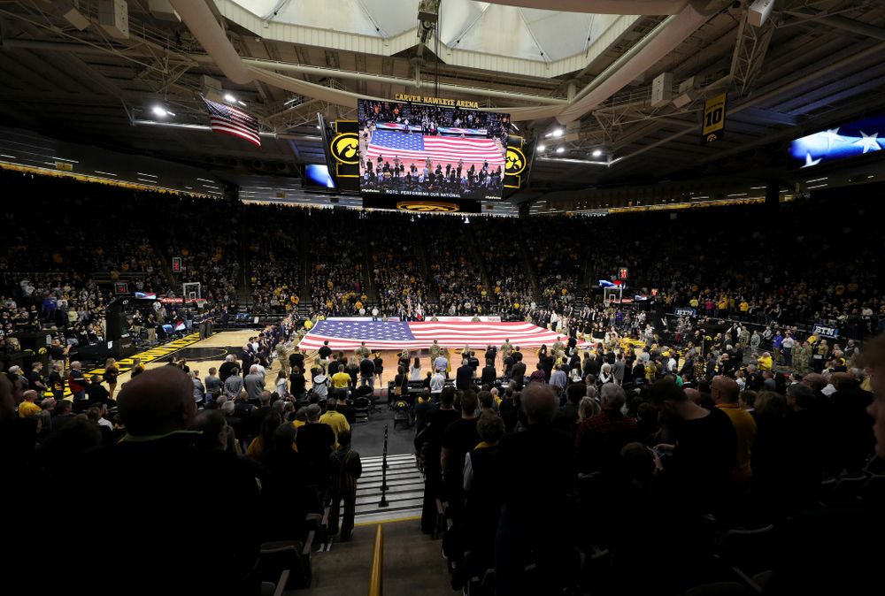 Members of the Iowa Army ROTC display a large American flag before the Iowa Hawkeyes game against Penn State Saturday, February 29, 2020 at Carver-Hawkeye Arena. (Brian Ray/hawkeyesports.com)