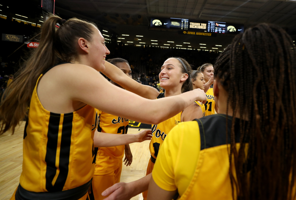 Iowa Hawkeyes forward Amanda Ollinger (43) hugs guard Megan Meyer (11) during senior day activities following their win over the Minnesota Golden Gophers Thursday, February 27, 2020 at Carver-Hawkeye Arena. (Brian Ray/hawkeyesports.com)