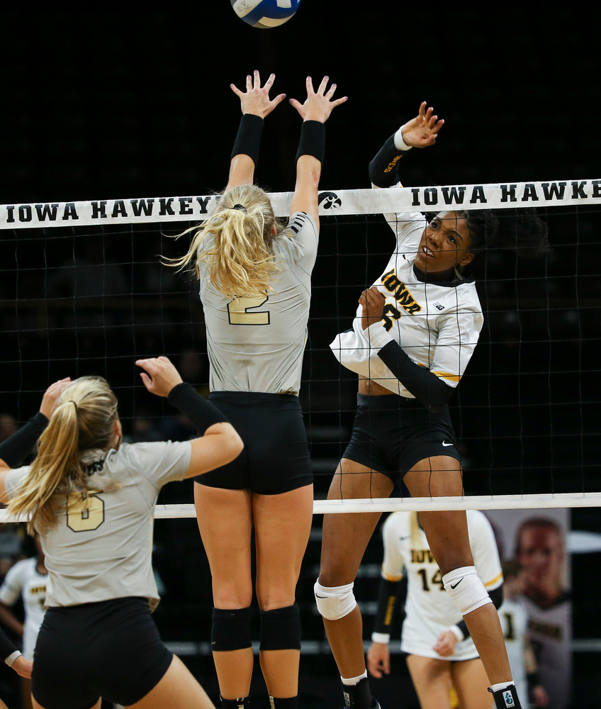 Iowa Hawkeyes outside hitter Taylor Louis (16) spikes the ball during a game against Purdue at Carver-Hawkeye Arena on October 13, 2018. (Tork Mason/hawkeyesports.com)