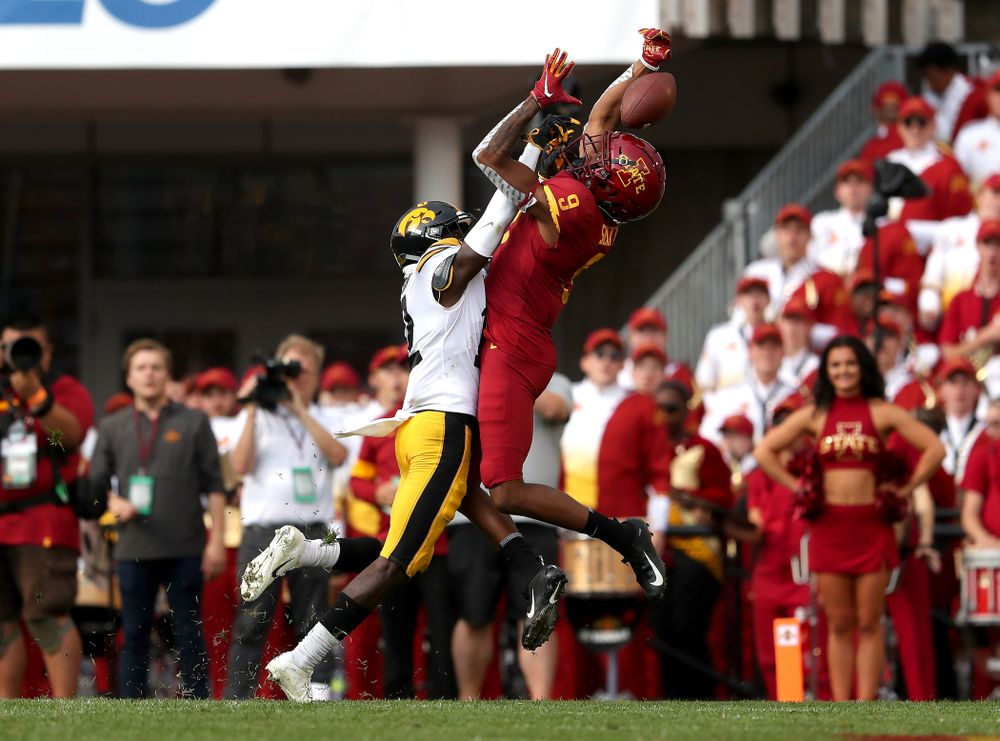 Iowa Hawkeyes defensive back D.J. Johnson (12) breaks up a pass intended for wide receiver Joseph Scates (9) Saturday, September 14, 2019 at Jack Trice Stadium in Ames, Iowa. (Brian Ray/hawkeyesports.com)