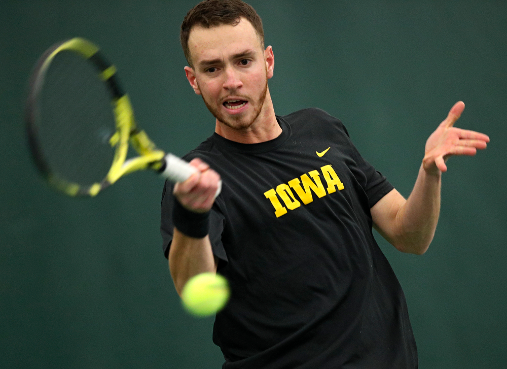 Iowa’s Kareem Allaf returns a shot during his singles match at the Hawkeye Tennis and Recreation Complex in Iowa City on Friday, March 6, 2020. (Stephen Mally/hawkeyesports.com)