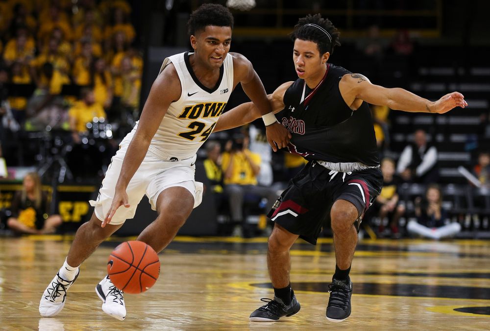 Iowa Hawkeyes guard Nicolas Hobbs (24) brings the ball upcourt during a game against Guilford College at Carver-Hawkeye Arena on November 4, 2018. (Tork Mason/hawkeyesports.com)