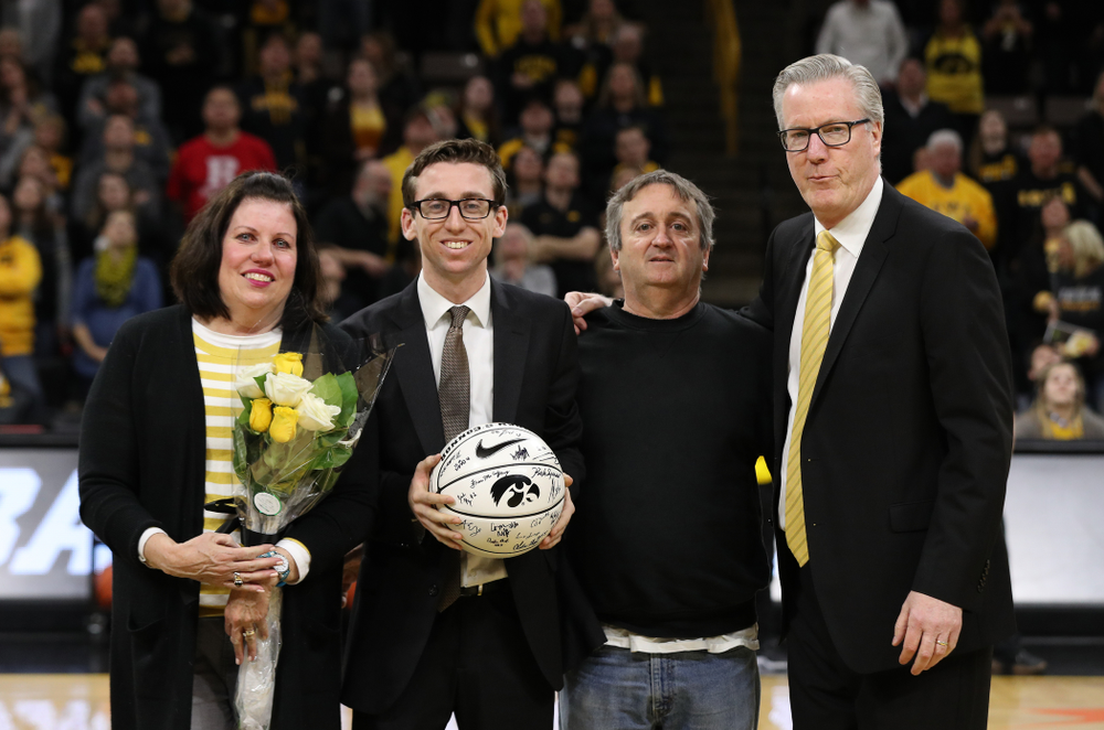 Senior Manager Brendan O'Connor stands with Iowa Hawkeyes head coach Fran McCaffery and his family during senior day activities before their game against the Rutgers Scarlet Knights Saturday, March 2, 2019 at Carver-Hawkeye Arena. (Brian Ray/hawkeyesports.com)