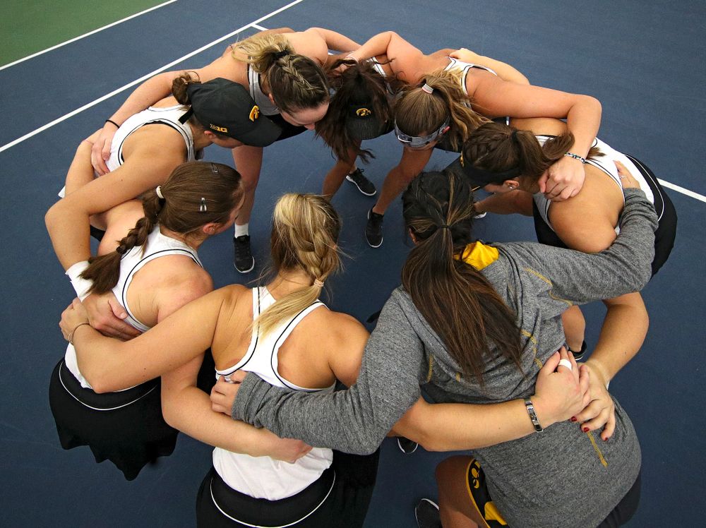The Hawkeyes huddle before their match at the Hawkeye Tennis and Recreation Complex in Iowa City on Sunday, February 16, 2020. (Stephen Mally/hawkeyesports.com)