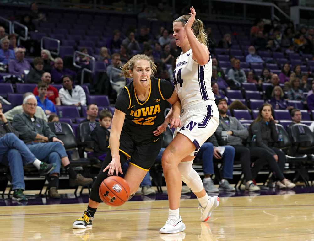 Iowa Hawkeyes guard Kathleen Doyle (22) drives to the hoop during the third quarter of their game at Welsh-Ryan Arena in Evanston, Ill. on Sunday, January 5, 2020. (Stephen Mally/hawkeyesports.com)