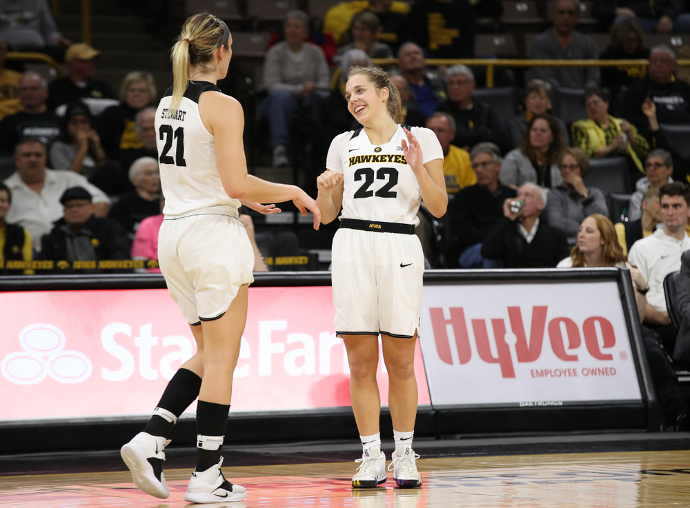 Iowa Hawkeyes forward Hannah Stewart (21) and guard Kathleen Doyle (22) against the Wisconsin Badgers Monday, January 7, 2019 at Carver-Hawkeye Arena. (Brian Ray/hawkeyesports.com)
