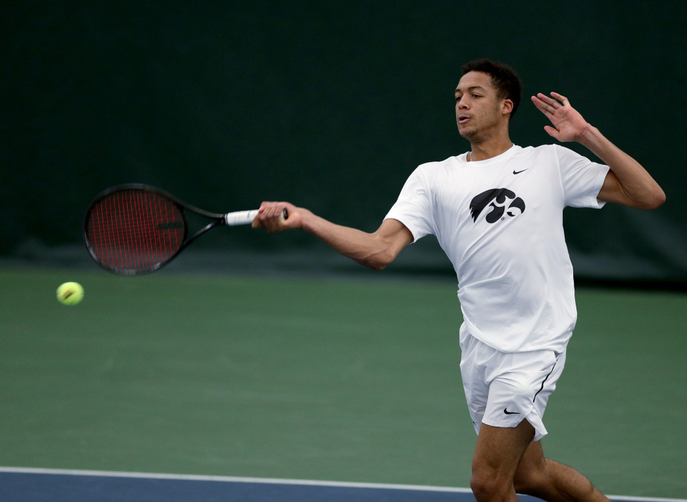 Iowa’s Oliver Okonkwo against Cornell Sunday, March 8, 2020 at the Hawkeye Tennis and Recreation Center. (Brian Ray/hawkeyesports.com)