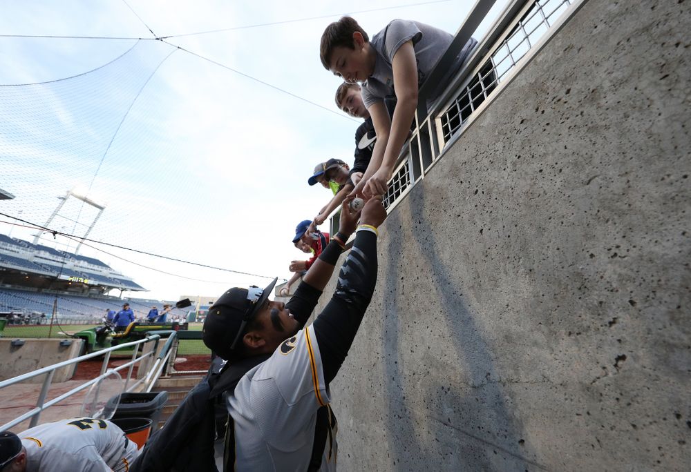 Iowa Hawkeyes Izaya Fullard (20) signs autographs following their game against the Indiana Hoosiers in the first round of the Big Ten Baseball Tournament Wednesday, May 22, 2019 at TD Ameritrade Park in Omaha, Neb. (Brian Ray/hawkeyesports.com)