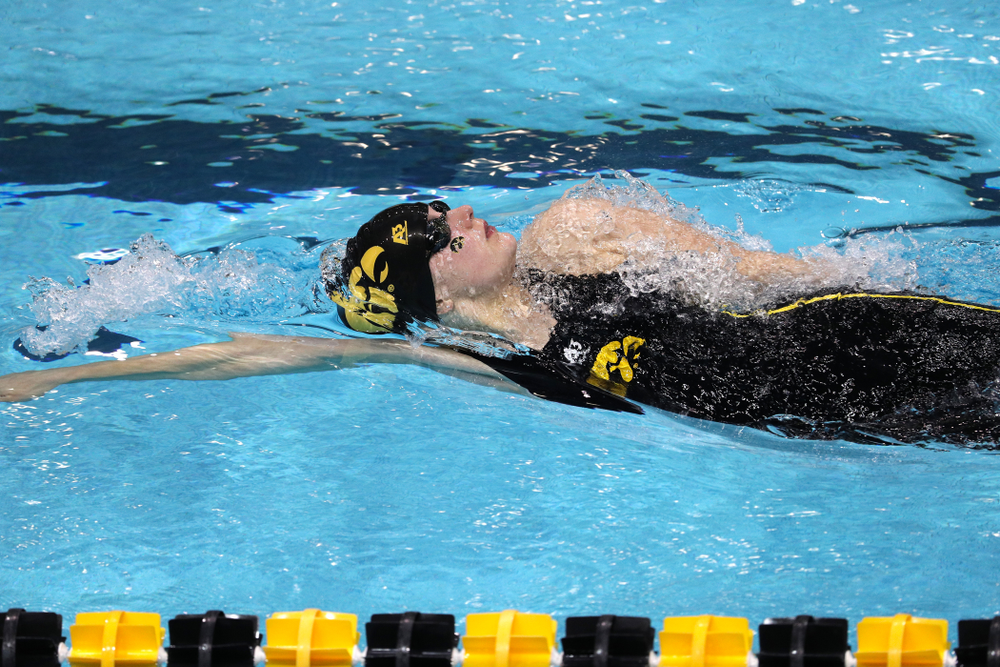 Iowa's Hannah Burvill swims the 100-yard backstroke against the Iowa State Cyclones in the Iowa Corn Cy-Hawk Series Friday, December 7, 2018 at at the Campus Recreation and Wellness Center. (Brian Ray/hawkeyesports.com)