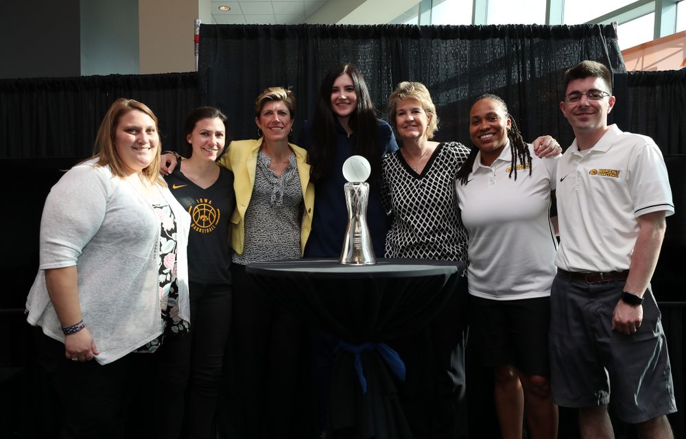 Iowa Hawkeyes forward Megan Gustafson (10) poses for photo with the Iowa Women's Basketball staff after winning the Associated Press Player Of The Year during a news conference Thursday, April 4, 2019 at Amalie Arena in Tampa, FL. (Brian Ray/hawkeyesports.com)