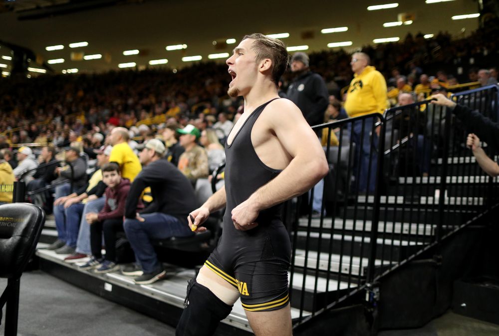 IowaÕs Spencer Lee cheers on teammate Austin DeSanto as he wrestles WisconsinÕs Seth Gross at 133 pounds Sunday, December 1, 2019 at Carver-Hawkeye Arena. DeSanto won the match 6-2. (Brian Ray/hawkeyesports.com)