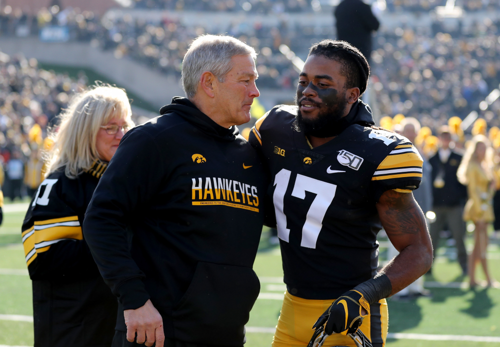 Iowa Hawkeyes head coach Kirk Ferentz hugs defensive back Devonte Young (17) during senior day festivities before their game against the Illinois Fighting Illini Saturday, November 23, 2019 at Kinnick Stadium. (Brian Ray/hawkeyesports.com)