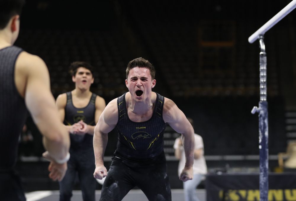 Iowa's Jake Brodarzon competes on the parallel bars against the Ohio State Buckeyes Saturday, March 16, 2019 at Carver-Hawkeye Arena. (Brian Ray/hawkeyesports.com)