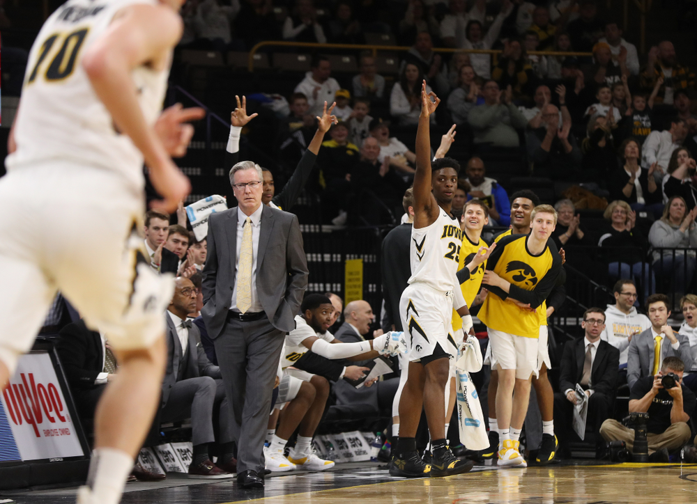 Iowa Hawkeyes forward Tyler Cook (25) celebrates a three point basket by guard Joe Wieskamp (10) against the Illinois Fighting Illini Sunday, January 20, 2019 (Brian Ray/hawkeyesports.com)