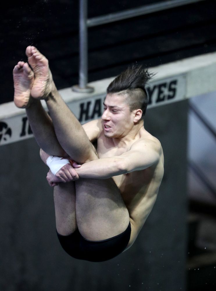 IowaÕs Jonatan Posligua competes on the 1 meter springboard against Notre Dame and Illinois Saturday, January 11, 2020 at the Campus Recreation and Wellness Center. (Brian Ray/hawkeyesports.com)