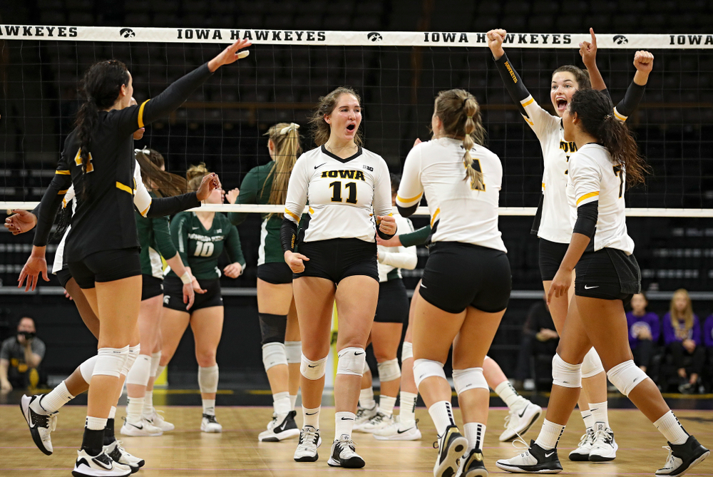 Iowa’s Halle Johnston (4), Griere Hughes (10), Blythe Rients (11), Joslyn Boyer (1), Courtney Buzzerio (2), and Brie Orr (7) celebrate a score during the second set of their volleyball match at Carver-Hawkeye Arena in Iowa City on Sunday, Oct 13, 2019. (Stephen Mally/hawkeyesports.com)