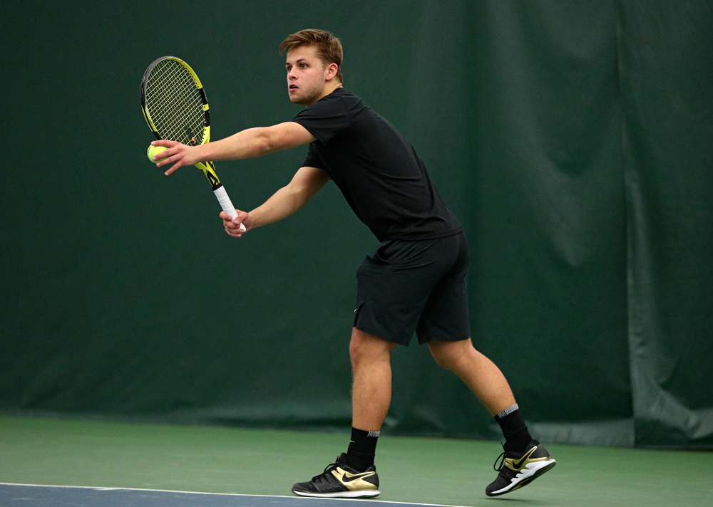 Iowa’s Will Davies serves during his singles match at the Hawkeye Tennis and Recreation Complex in Iowa City on Friday, March 6, 2020. (Stephen Mally/hawkeyesports.com)