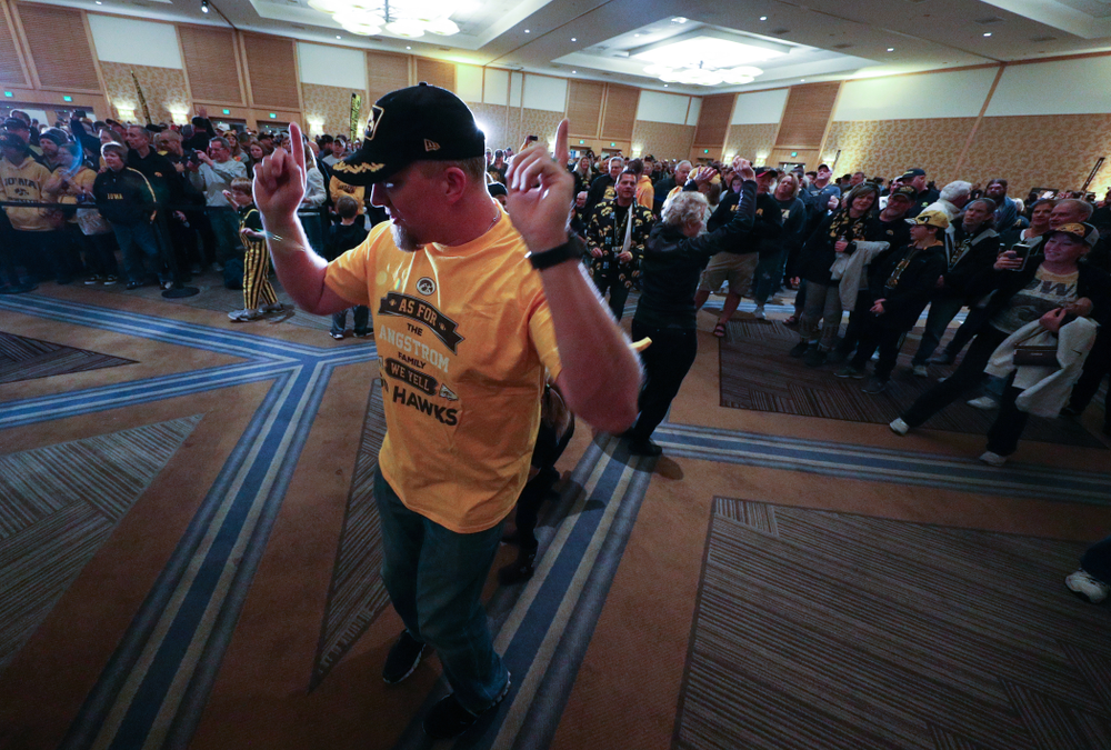 Fans dance to the Hokey Pokey in honor of the late Hayden Fry during the Holiday Bowl Hawkeye Huddle Thursday, December 26, 2019 at the Hilton in downtown San Diego. (Brian Ray/hawkeyesports.com)
