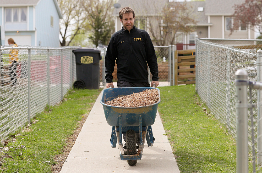 Iowa field hockey players re-mulch the playground at the HACAP Coral Ridge Head Start Center during the 21st annual ISAAC Hawkeye Day of Caring in Coralville on Sunday, Apr. 28, 2019. (Stephen Mally/hawkeyesports.com)