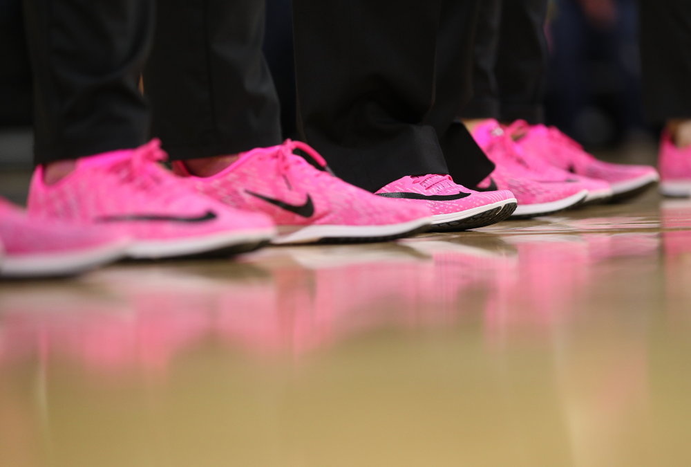 The Iowa Hawkeyes coaches and staff wear pink shoes against the Wisconsin Badgers Sunday, February 16, 2020 at Carver-Hawkeye Arena. (Brian Ray/hawkeyesports.com)