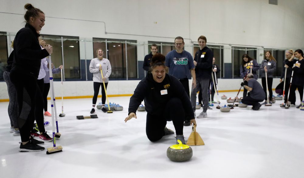 Members of the Iowa Softball team learn the sport of curling as part of a team building event Wednesday, January 10, 2018 at the Cedar Rapids Ice Arena. (Brian Ray/hawkeyesports.com)