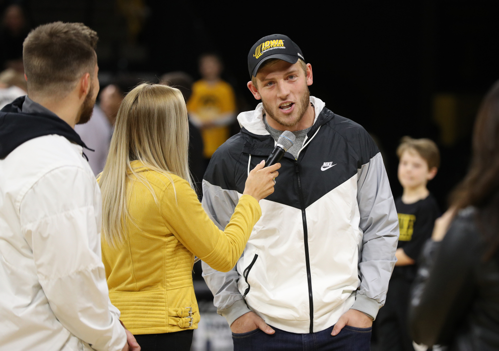 The Hawkeye Football team is introduced during a timeout of the Iowa Hawkeyes game against the Michigan Wolverines Friday, February 1, 2019 at Carver-Hawkeye Arena. (Brian Ray/hawkeyesports.com)
