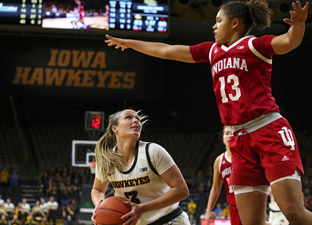 Iowa Hawkeyes guard Makenzie Meyer (3) waits for Indiana Hoosiers guard Jaelynn Penn (13) to clear before making a basket during the second overtime period of their game at Carver-Hawkeye Arena in Iowa City on Sunday, January 12, 2020. (Stephen Mally/hawkeyesports.com)