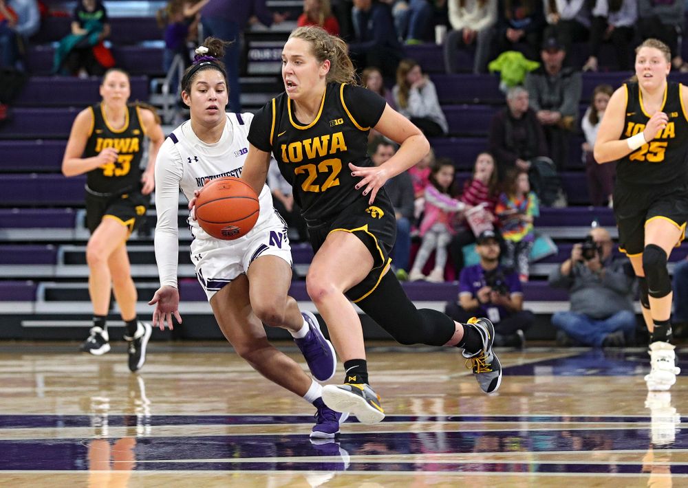 Iowa Hawkeyes guard Kathleen Doyle (22) drives down the court with the ball during the third quarter of their game at Welsh-Ryan Arena in Evanston, Ill. on Sunday, January 5, 2020. (Stephen Mally/hawkeyesports.com)