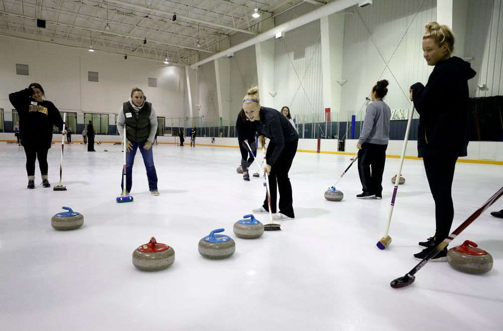 Members of the Iowa Softball team learn the sport of curling as part of a team building event Wednesday, January 10, 2018 at the Cedar Rapids Ice Arena. (Brian Ray/hawkeyesports.com)
