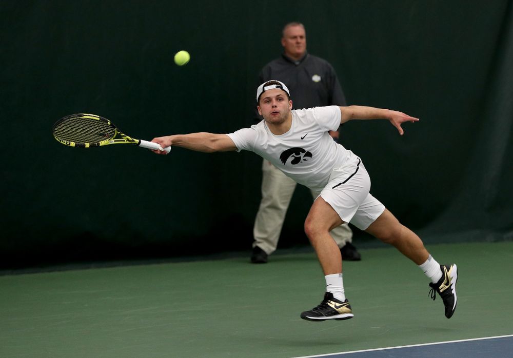 Iowa’s Will Davies against Cornell Sunday, March 8, 2020 at the Hawkeye Tennis and Recreation Center. (Brian Ray/hawkeyesports.com)