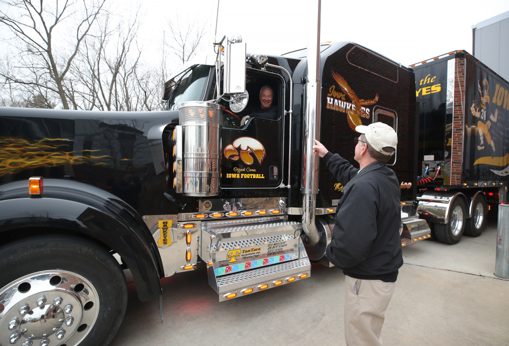 TanTara Transportation Corporation President Mike Riggan talks with head football equipment manager Greg Morris before departing for Tampa Florida Friday, December 21, 2018 at the Hansen Football Performance Center. (Brian Ray/hawkeyesports.com)