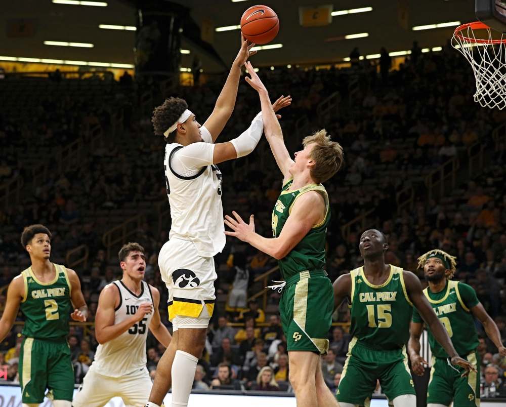 Iowa Hawkeyes forward Cordell Pemsl (35) scores a basket while being fouled during the second half of their game at Carver-Hawkeye Arena in Iowa City on Sunday, Nov 24, 2019. (Stephen Mally/hawkeyesports.com)