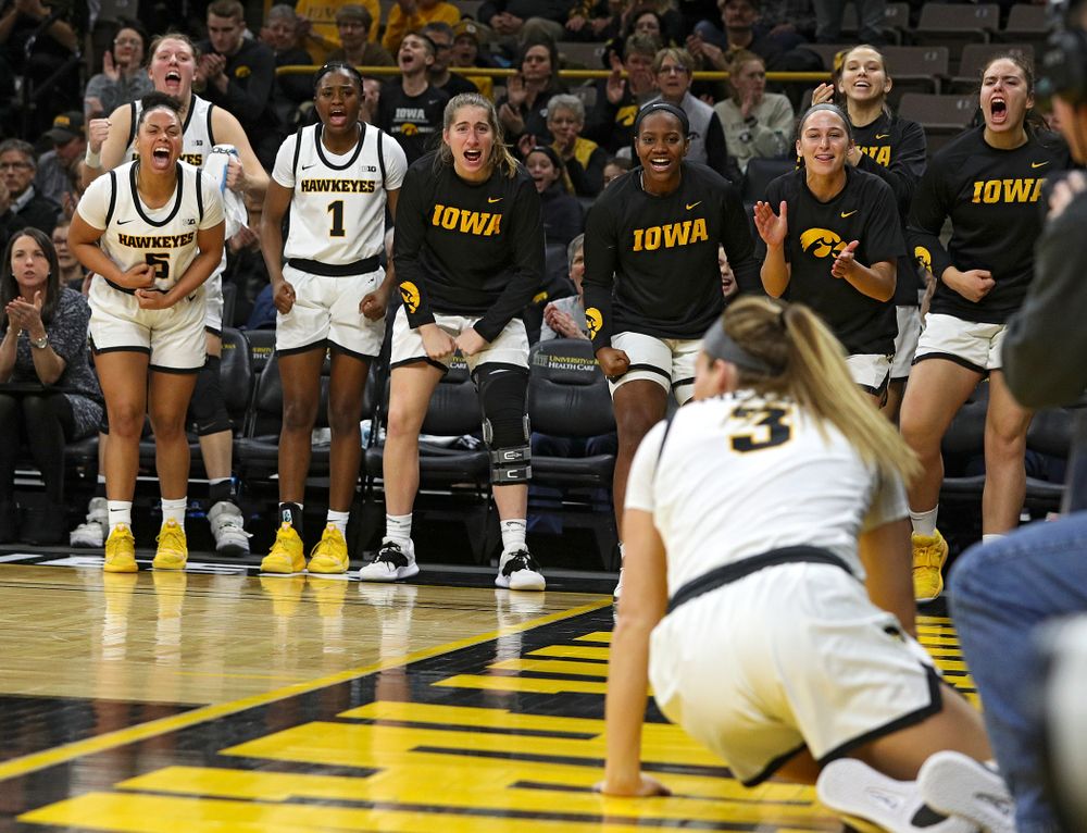 The Iowa bench reacts after Iowa Hawkeyes guard Makenzie Meyer (3) made a basket while being fouled during the third quarter of their game at Carver-Hawkeye Arena in Iowa City on Sunday, January 12, 2020. (Stephen Mally/hawkeyesports.com)