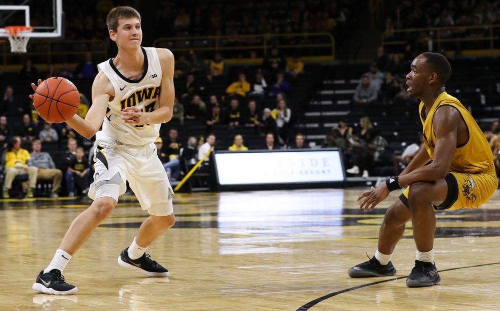 Iowa Hawkeyes guard Austin Ash (13) passes the ball during a game against Alabama State at Carver-Hawkeye Arena on November 21, 2018. (Tork Mason/hawkeyesports.com)