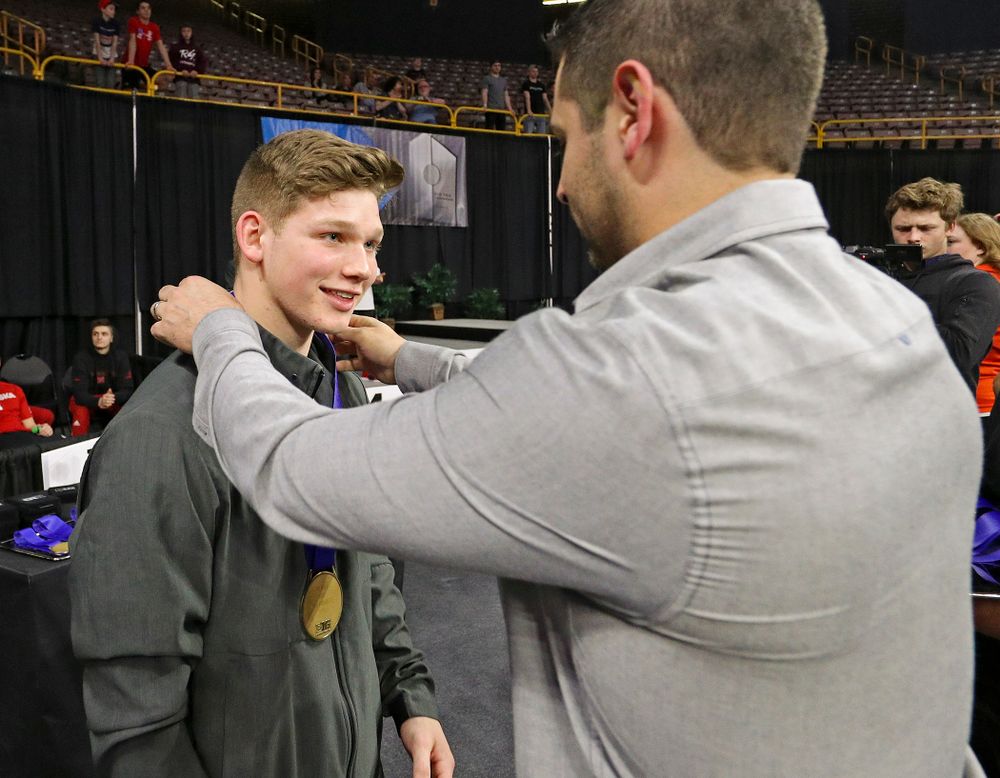 Iowa's Stewart Brown receives a bronze medal for this
third place finish in the vault during the second day of the Big Ten Men's Gymnastics Championships at Carver-Hawkeye Arena in Iowa City on Saturday, Apr. 6, 2019. (Stephen Mally/hawkeyesports.com)