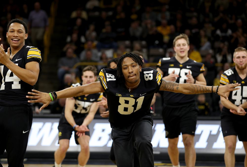 Members of the Hawkeye Football team performs with the Iowa Dance Team at halftime of the Iowa Hawkeyes game against the Ohio State Buckeyes Thursday, February 20, 2020 at Carver-Hawkeye Arena. (Brian Ray/hawkeyesports.com)