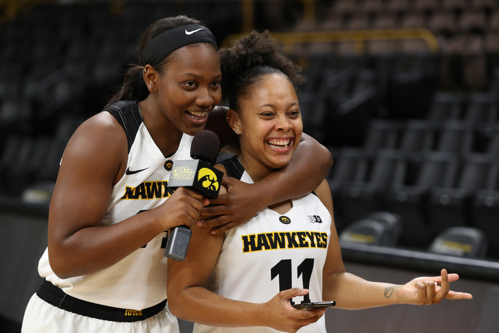 Iowa Hawkeyes guard Zion Sanders (24) interviews guard Tania Davis (11) for a Facebook Live during the team's annual media day Wednesday, October 31, 2018 at Carver-Hawkeye Arena. (Brian Ray/hawkeyesports.com)