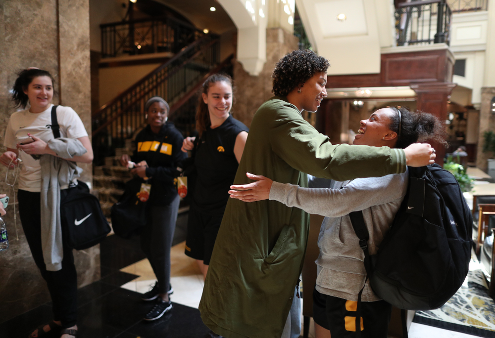 Former Hawkeye Chase Coley hugs the players following shoot around before their regional final against the Baylor Lady Bears in the 2019 NCAA Women's College Basketball Tournament Monday, April 1, 2019 at Greensboro Coliseum in Greensboro, NC.(Brian Ray/hawkeyesports.com)