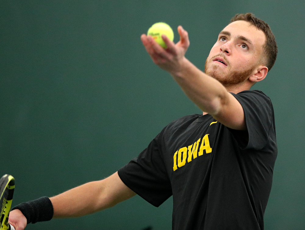 Iowa’s Kareem Allaf serves during his singles match at the Hawkeye Tennis and Recreation Complex in Iowa City on Friday, February 14, 2020. (Stephen Mally/hawkeyesports.com)