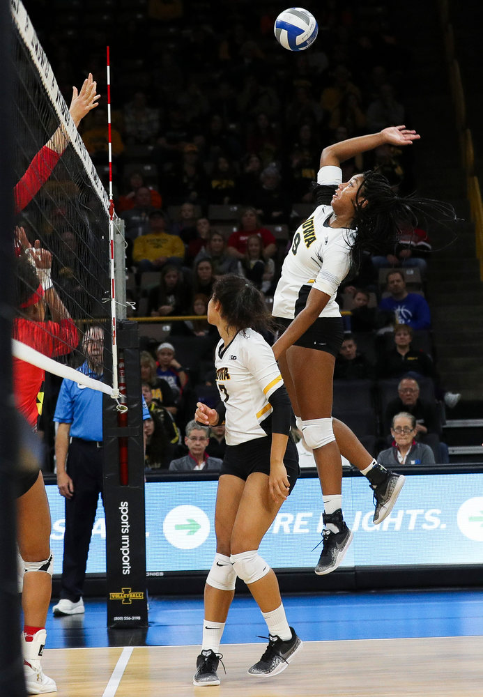 Iowa Hawkeyes middle blocker Amiya Jones (9) spikes the ball during a match against Maryland at Carver-Hawkeye Arena on November 23, 2018. (Tork Mason/hawkeyesports.com)