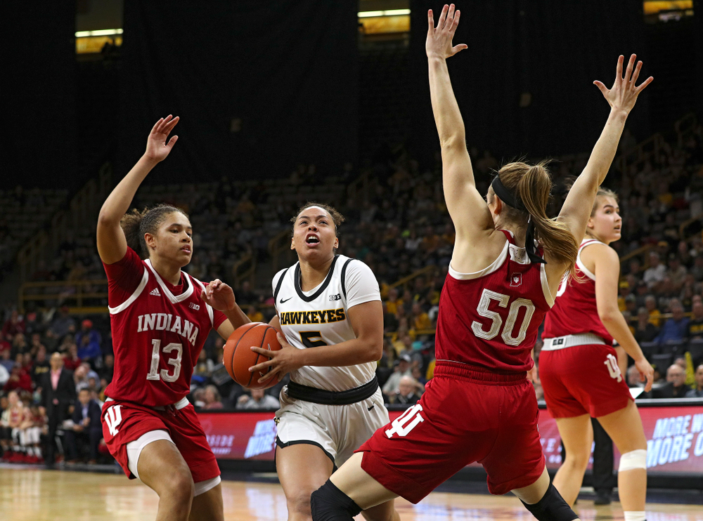 Iowa Hawkeyes guard Alexis Sevillian (5) drives in before being fouled during the second overtime period of their game at Carver-Hawkeye Arena in Iowa City on Sunday, January 12, 2020. (Stephen Mally/hawkeyesports.com)