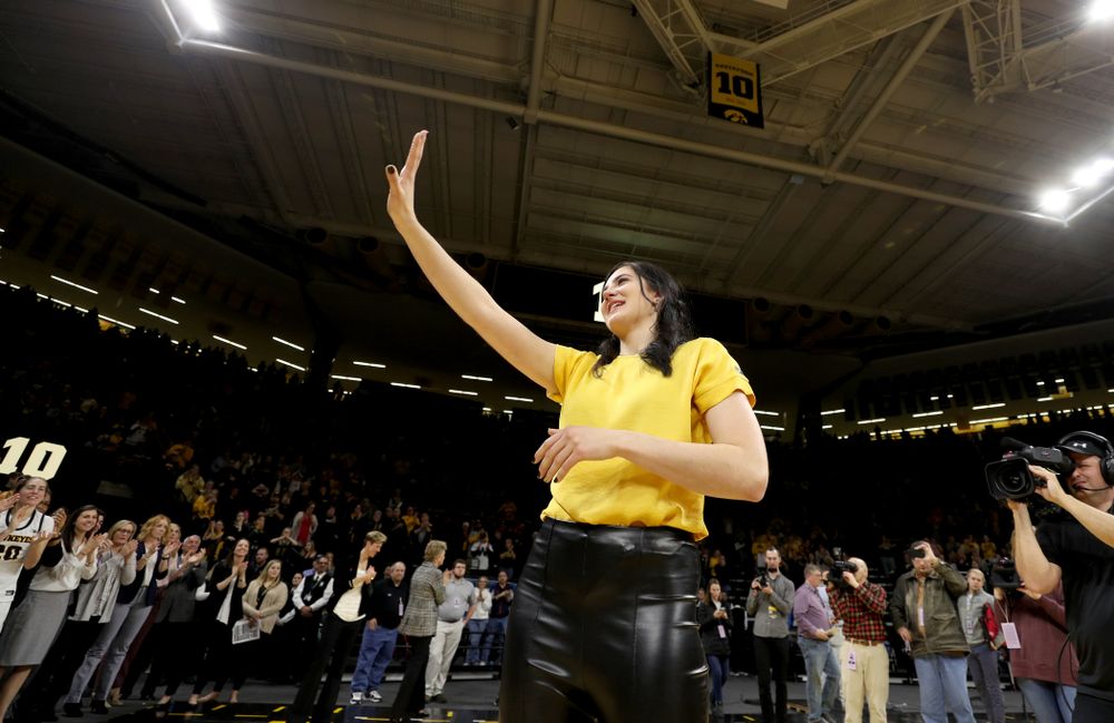 Megan Gustafson waves to the fans after her number was raised into the rafters during a jersey retirement ceremony Sunday, January 26, 2020 at Carver-Hawkeye Arena. (Brian Ray/hawkeyesports.com)