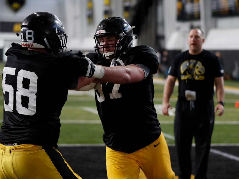 Iowa Hawkeyes offensive lineman Jake Newborg (58) and offensive lineman Levi Duwa (67) during spring practice Thursday, March 29, 2018 at the Hansen Football Performance Center. (Brian Ray/hawkeyesports.com)