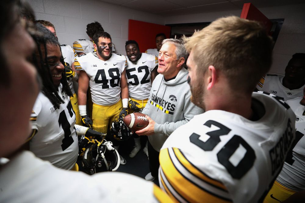 Iowa Hawkeyes defensive back Jake Gervase (30) presents the game ball to head coach Kirk Ferentz to commemorate his 150th win as head coach fo the Iowa Hawkeyes following their 63-0 win over the Illinois Fighting Illini Saturday, November 17, 2018 at Memorial Stadium in Champaign, Ill. (Brian Ray/hawkeyesports.com)