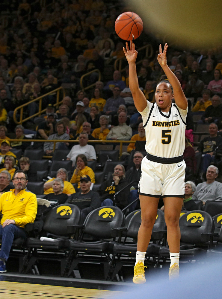 Iowa Hawkeyes guard Alexis Sevillian (5) makes a 3-pointer during the first quarter of the game at Carver-Hawkeye Arena in Iowa City on Thursday, February 6, 2020. (Stephen Mally/hawkeyesports.com)