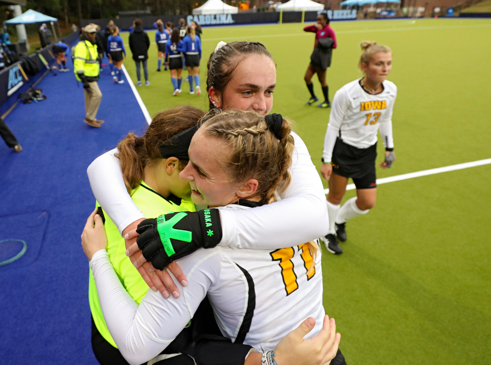 Iowa’s Grace McGuire (62) Katie Birch (11) and Anthe Nijziel (6) hug after winning their NCAA Tournament First Round match against Duke at Karen Shelton Stadium in Chapel Hill, N.C. on Friday, Nov 15, 2019. (Stephen Mally/hawkeyesports.com)